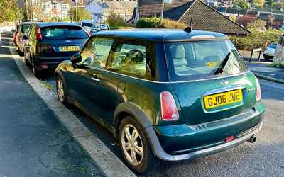GJ06 JUE, a Green Mini Cooper parked in Hollingdean
