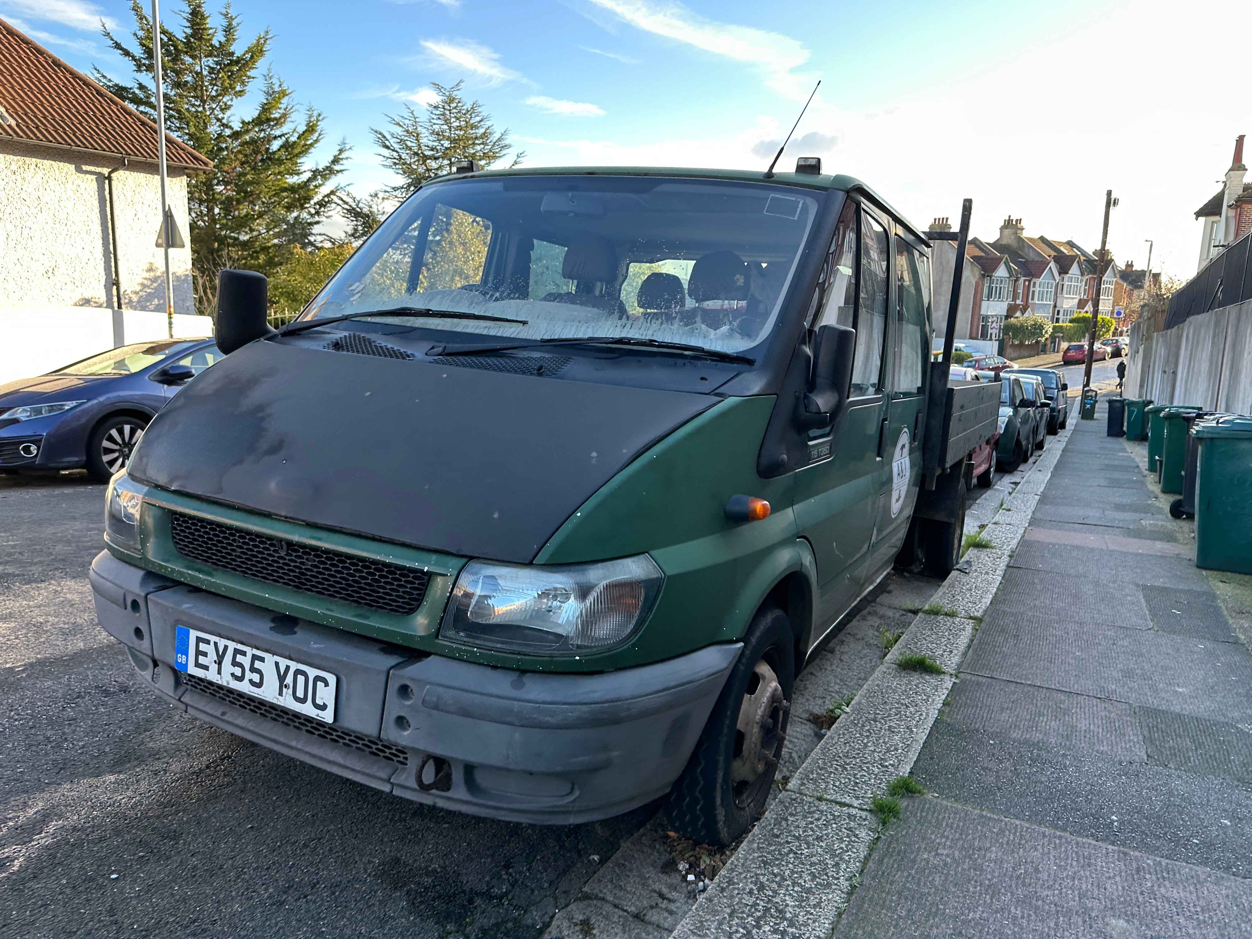 Photograph of EY55 YOC - a Green Ford Transit parked in Hollingdean by a non-resident, and potentially abandoned. The first of three photographs supplied by the residents of Hollingdean.