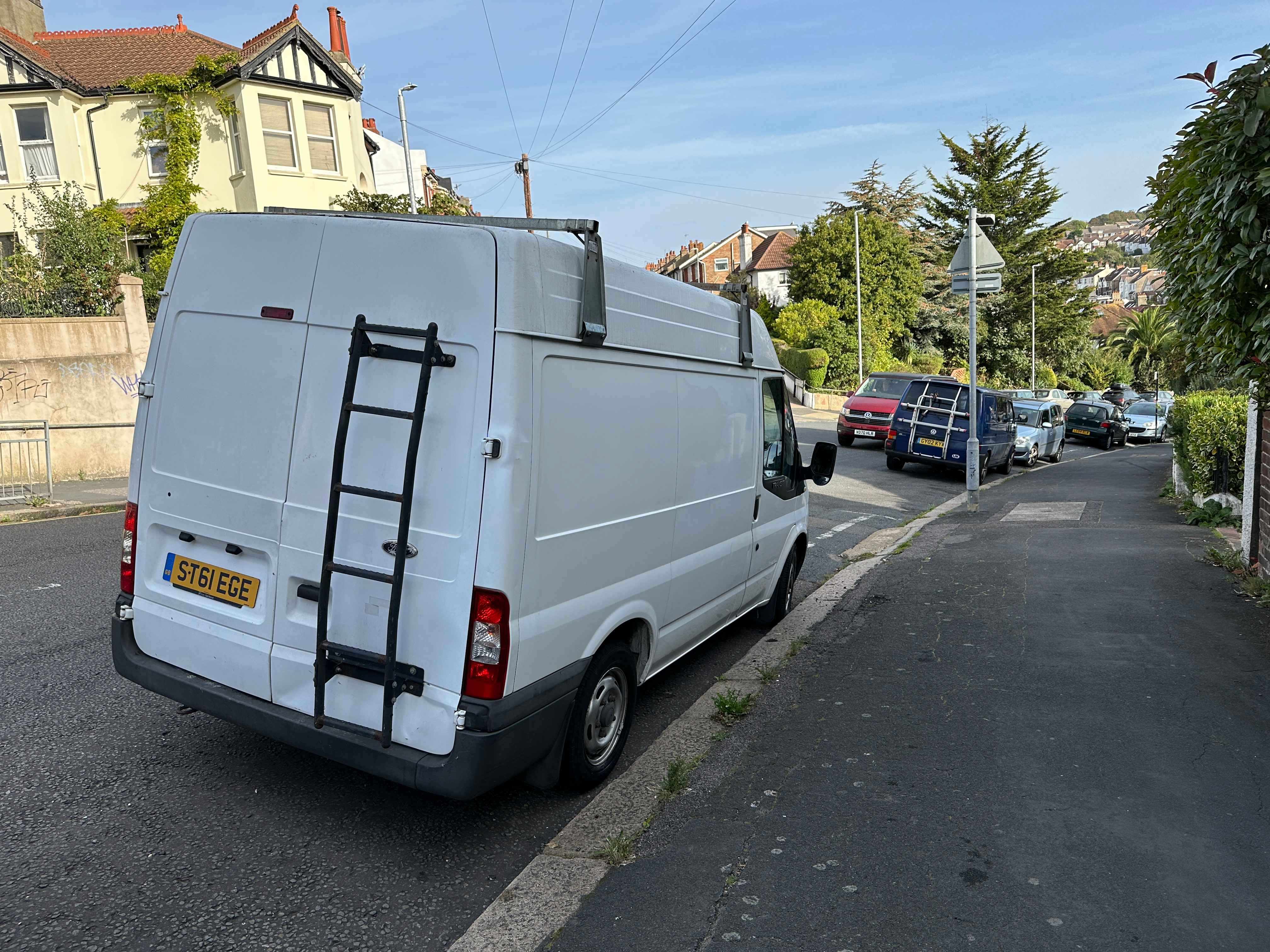 Photograph of ST61 EGE - a White Ford Transit parked in Hollingdean by a non-resident. The first of six photographs supplied by the residents of Hollingdean.