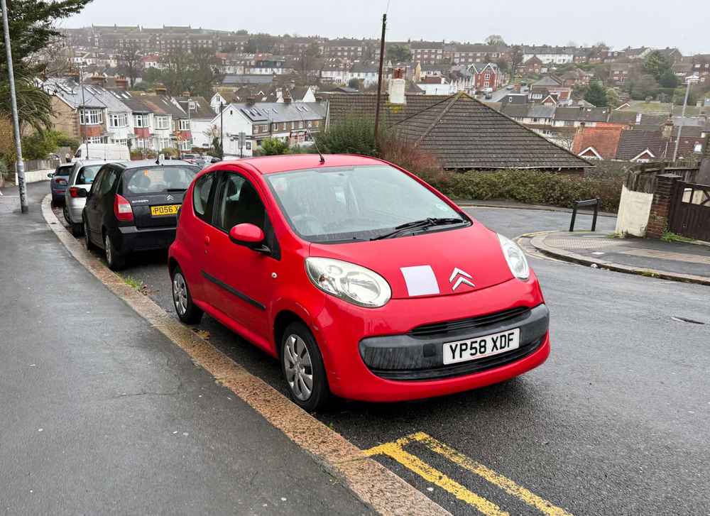Photograph of YP58 XDF - a Red Citroen C1 parked in Hollingdean by a non-resident, and potentially abandoned. The seventeenth of twenty photographs supplied by the residents of Hollingdean.