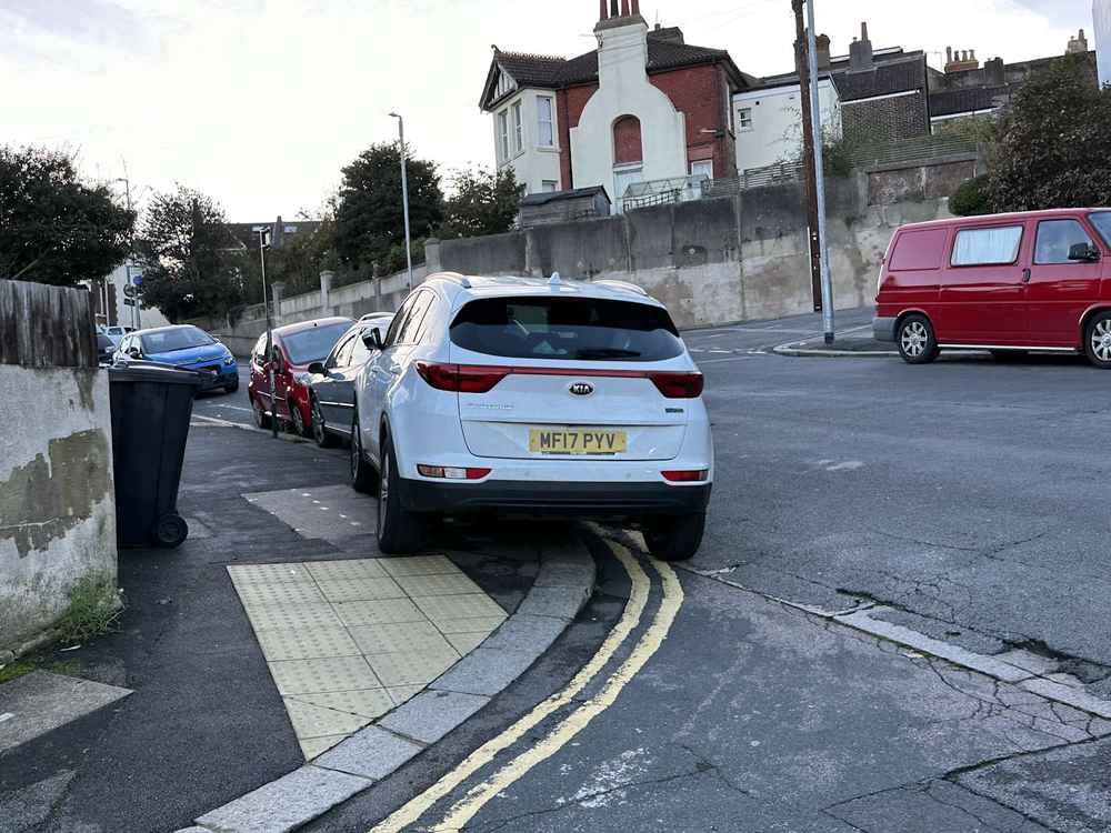 Photograph of MF17 PYV - a White Kia Sportage parked in Hollingdean by a non-resident. The first of two photographs supplied by the residents of Hollingdean.