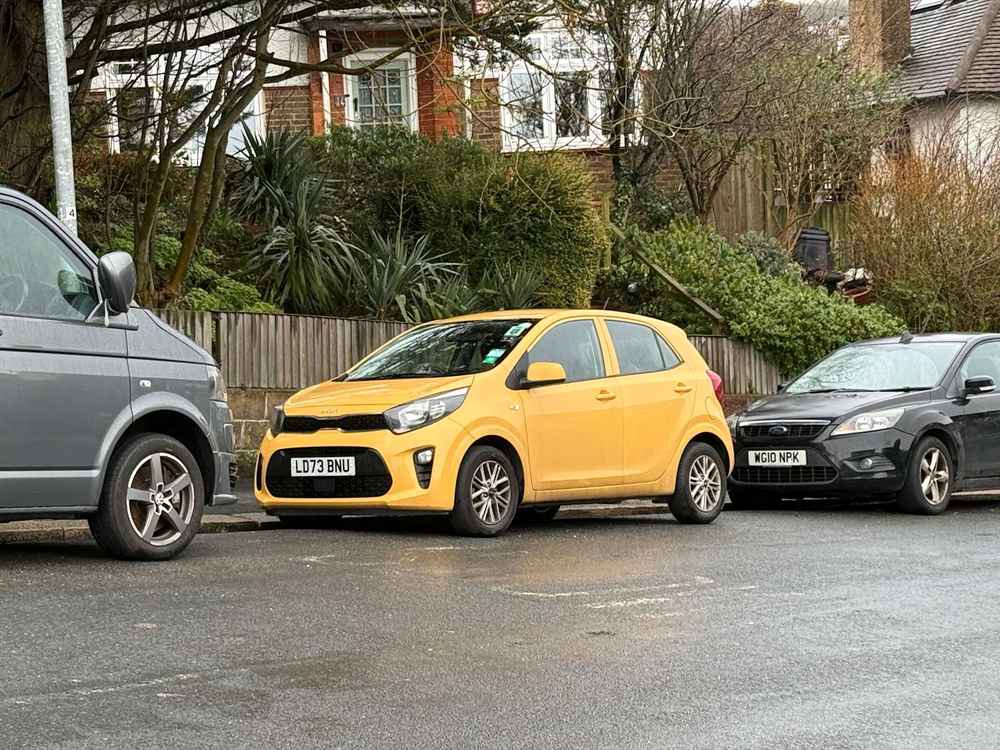 Photograph of LD73 BNU - a Yellow Kia Picanto parked in Hollingdean by a non-resident. The thirteenth of thirteen photographs supplied by the residents of Hollingdean.