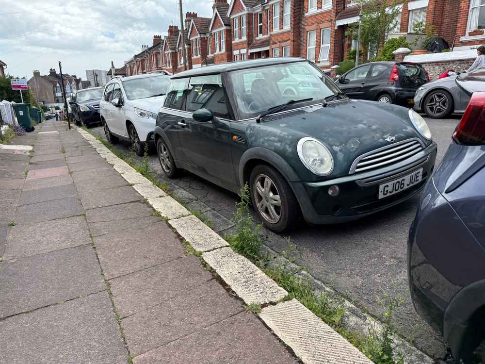 Photograph of GJ06 JUE - a Green Mini Cooper parked in Hollingdean by a non-resident. The twenty-third of twenty-three photographs supplied by the residents of Hollingdean.