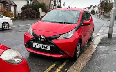 BF15 HRO, a Red Toyota Aygo parked in Hollingdean