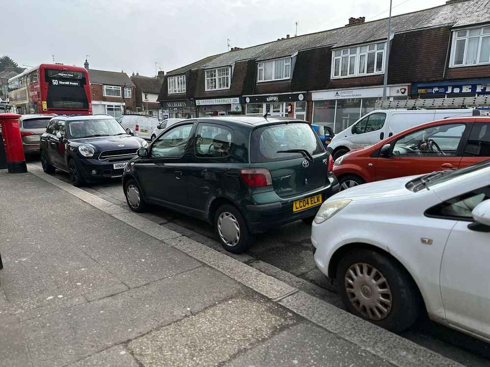 Photograph of LC04 ELW - a Green Toyota Yaris parked in Hollingdean by a non-resident. The eleventh of twelve photographs supplied by the residents of Hollingdean.