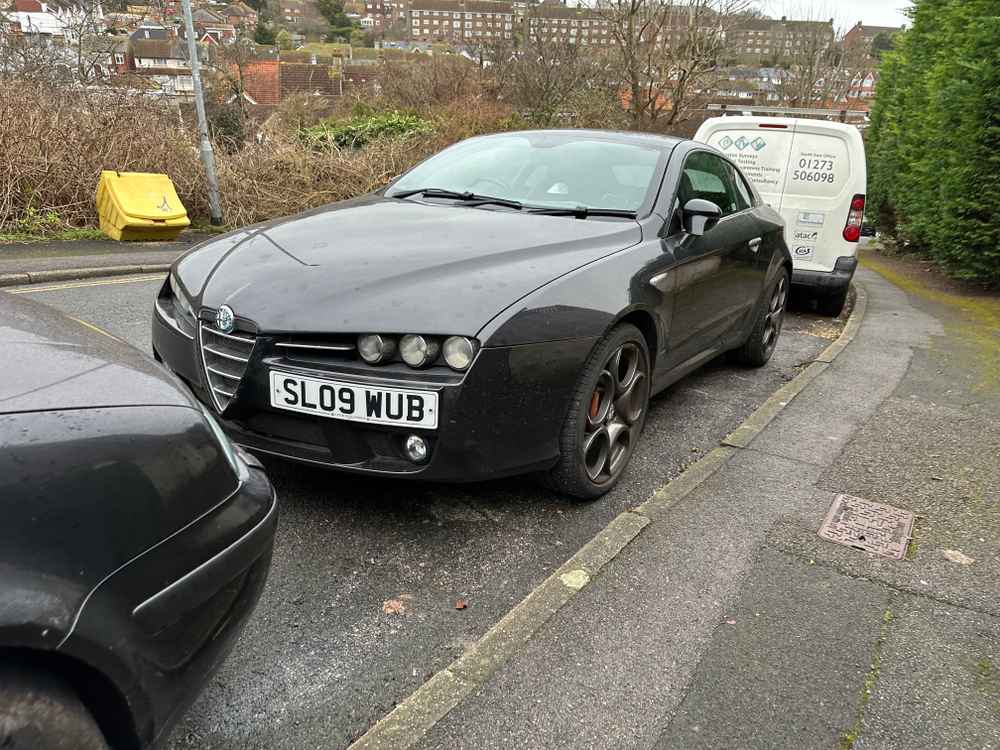 Photograph of SL09 WUB - a Black Alfa Romeo Brera parked in Hollingdean by a non-resident. The sixteenth of twenty-six photographs supplied by the residents of Hollingdean.