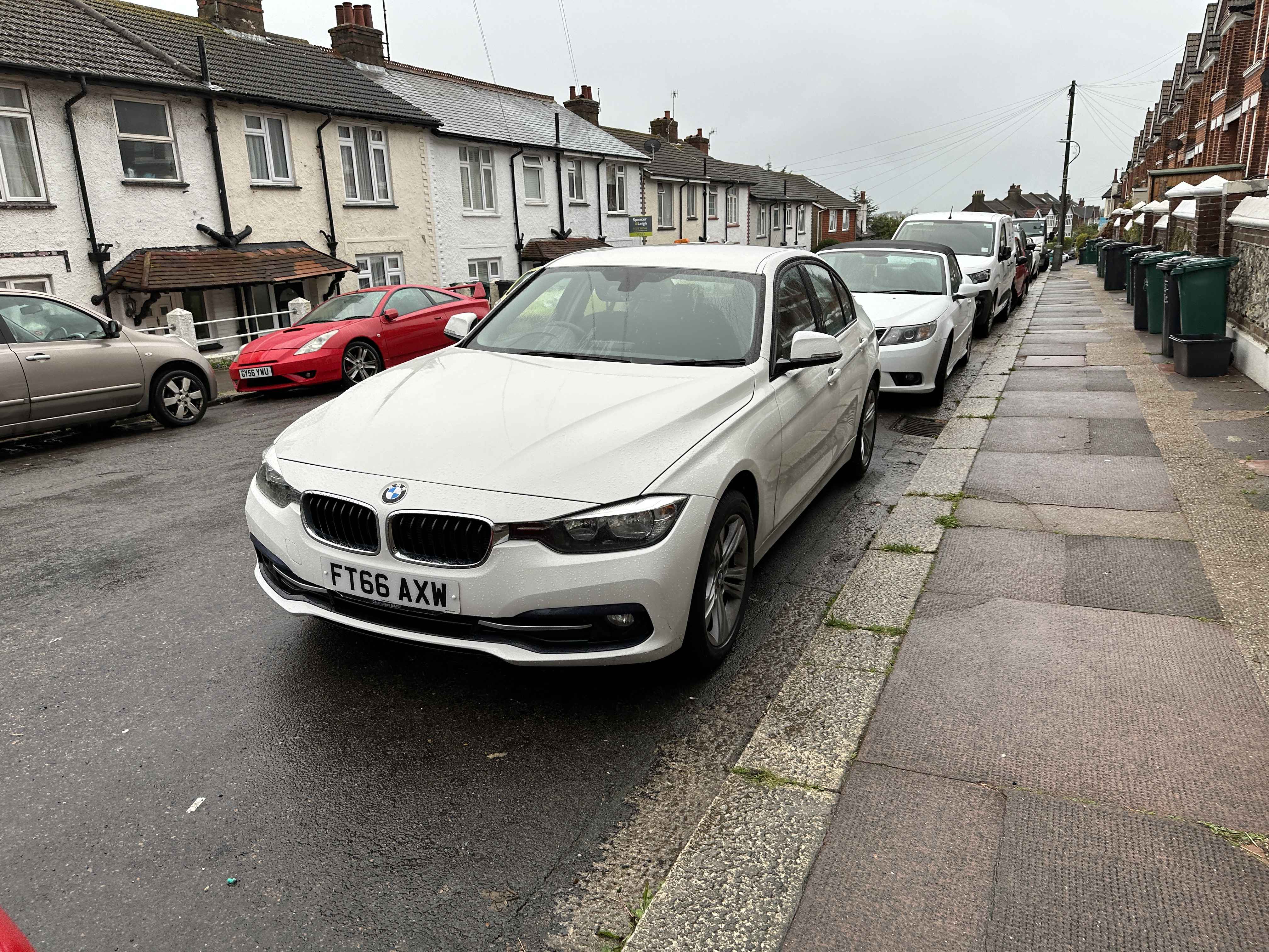 Photograph of FT66 AXW - a White BMW 3 Series parked in Hollingdean by a non-resident who uses the local area as part of their Brighton commute. The first of seven photographs supplied by the residents of Hollingdean.