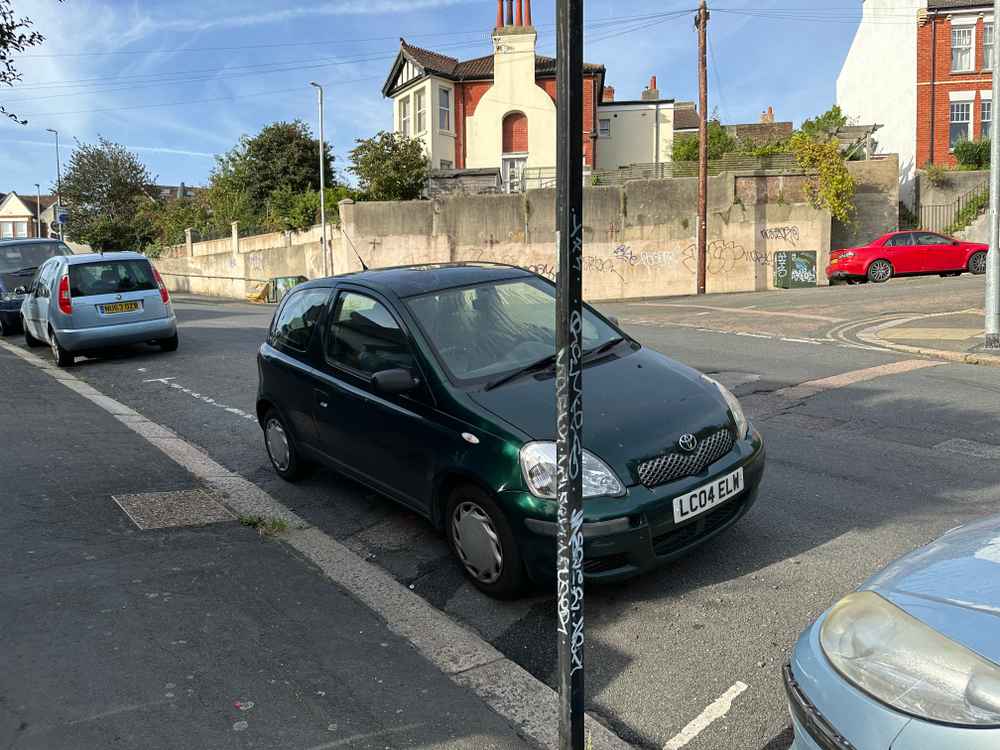 Photograph of LC04 ELW - a Green Toyota Yaris parked in Hollingdean by a non-resident. The first of twelve photographs supplied by the residents of Hollingdean.
