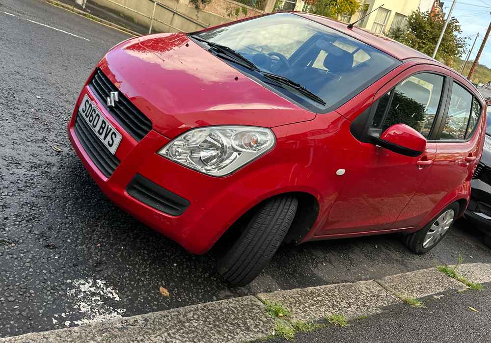 Photograph of SD60 BVS - a Red Suzuki Splash parked in Hollingdean by a non-resident. The second of two photographs supplied by the residents of Hollingdean.