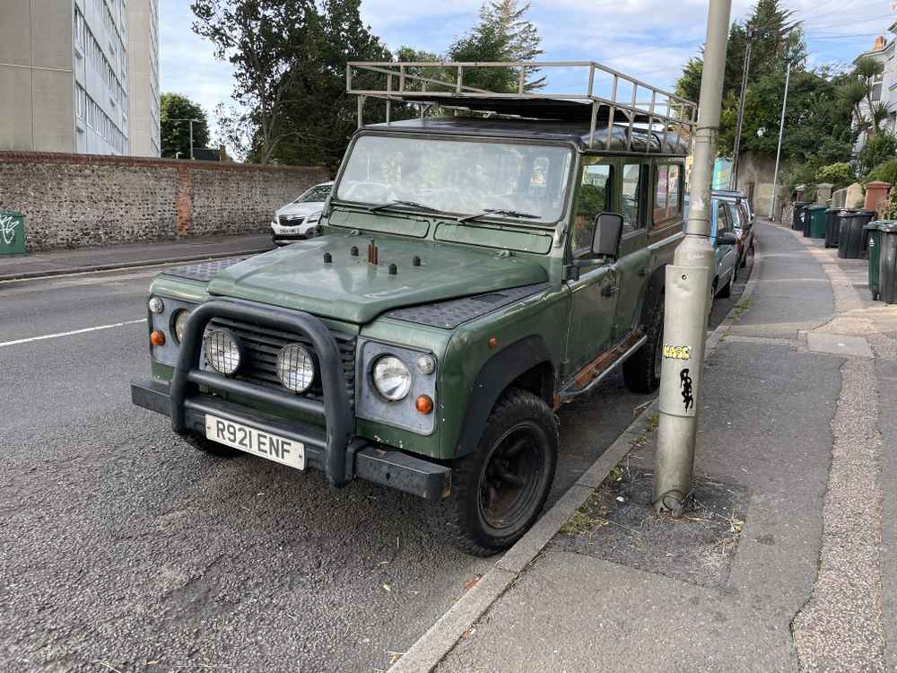 Photograph of R921 ENF - a Green Land Rover Defender parked in Hollingdean by a non-resident. The first of six photographs supplied by the residents of Hollingdean.