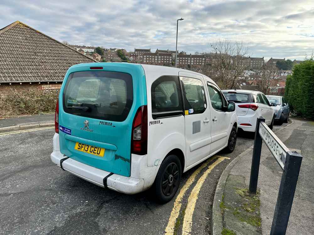 Photograph of SF13 GEU - a White Peugeot Premier taxi parked in Hollingdean by a non-resident, and potentially abandoned. The fourth of four photographs supplied by the residents of Hollingdean.