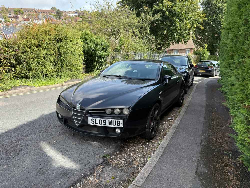 Photograph of SL09 WUB - a Black Alfa Romeo Brera parked in Hollingdean by a non-resident. The thirty-sixth of forty photographs supplied by the residents of Hollingdean.