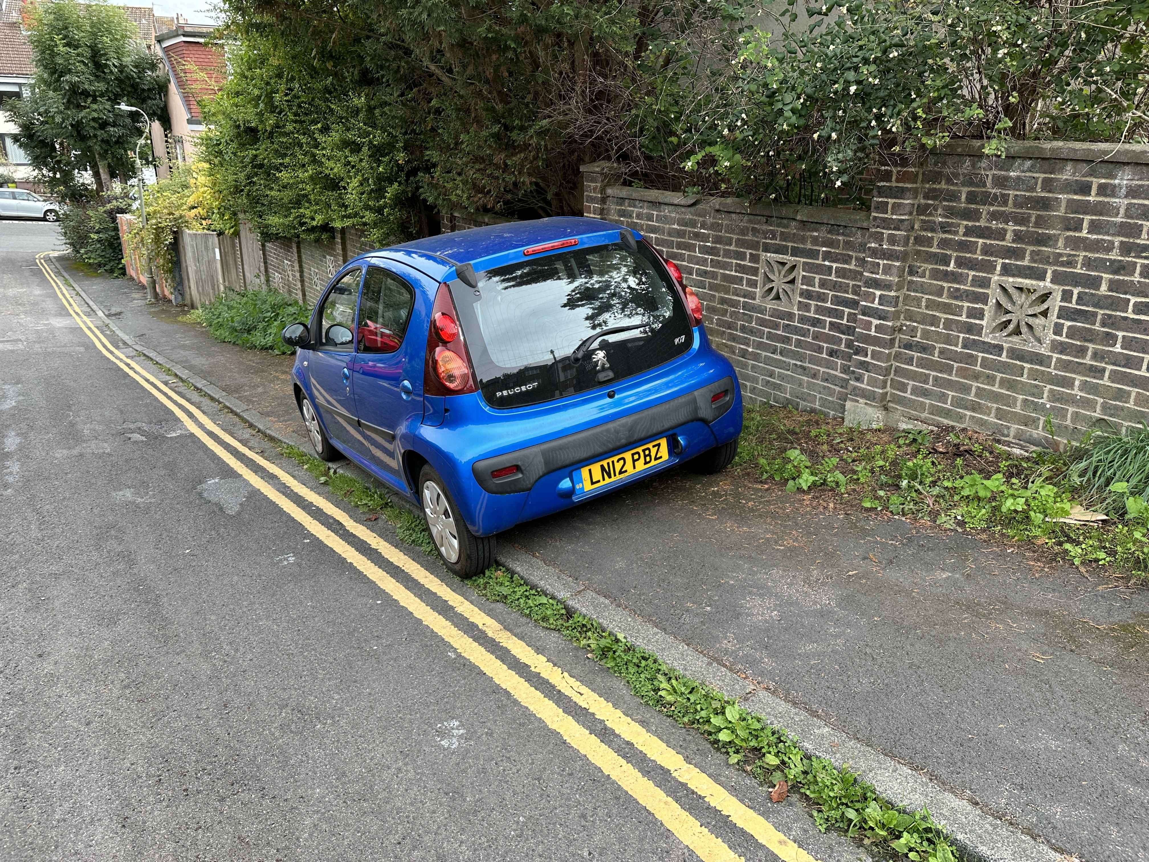 Photograph of LN12 PBZ - a Blue Peugeot 107 parked in Hollingdean by a non-resident. The third of six photographs supplied by the residents of Hollingdean.