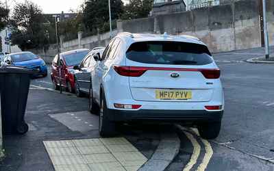MF17 PYV, a White Kia Sportage parked in Hollingdean