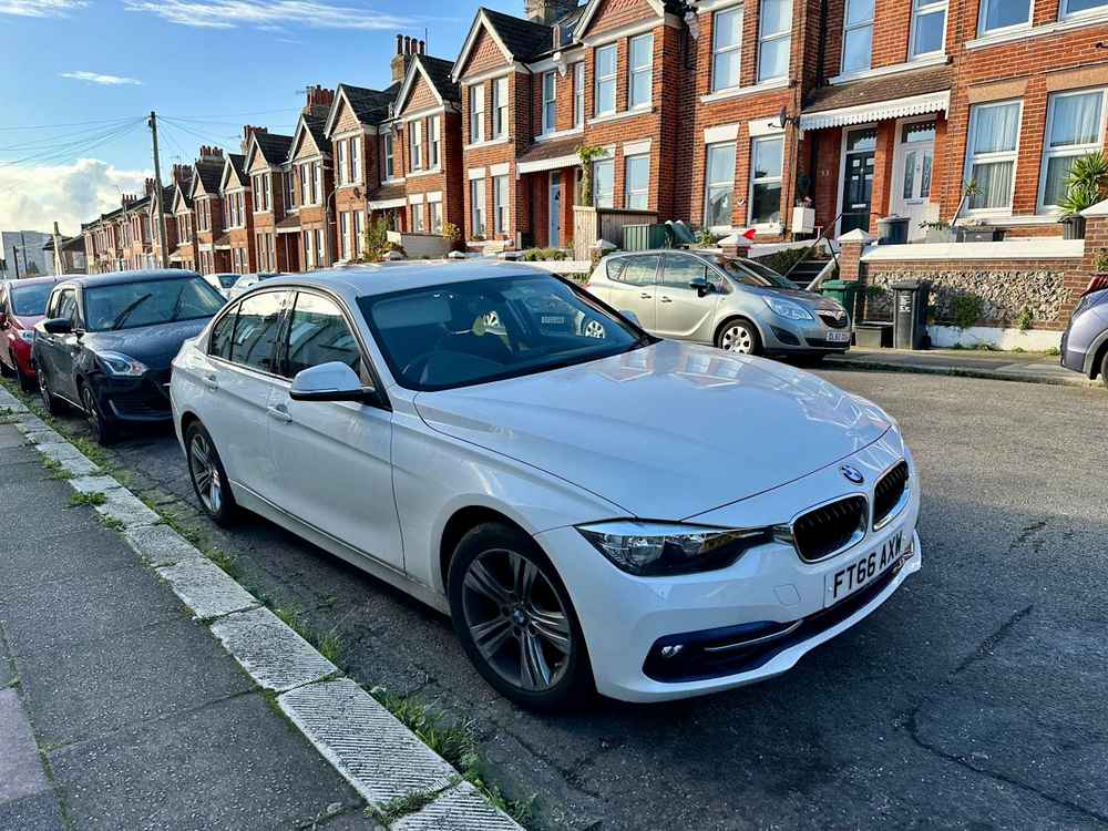 Photograph of FT66 AXW - a White BMW 3 Series parked in Hollingdean by a non-resident who uses the local area as part of their Brighton commute. The fourth of twenty-five photographs supplied by the residents of Hollingdean.