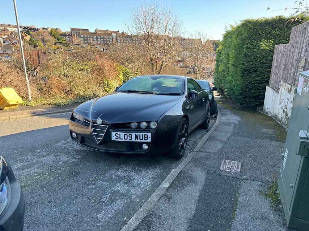 Photograph of SL09 WUB - a Black Alfa Romeo Brera parked in Hollingdean by a non-resident. The twenty-eighth of forty-four photographs supplied by the residents of Hollingdean.
