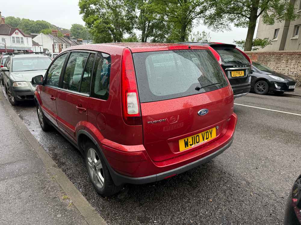 Photograph of WJ10 VDY - a Red Ford Fusion parked in Hollingdean by a non-resident. The second of two photographs supplied by the residents of Hollingdean.