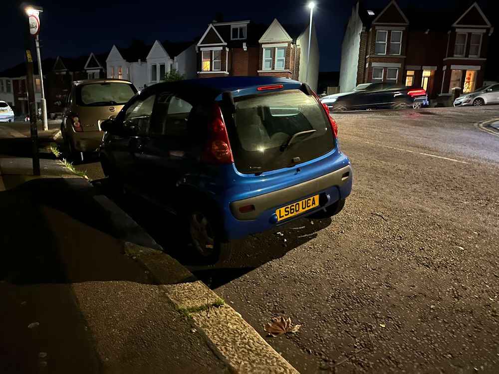 Photograph of LS60 UCA - a Blue Peugeot 107 parked in Hollingdean by a non-resident. The fourth of thirty photographs supplied by the residents of Hollingdean.