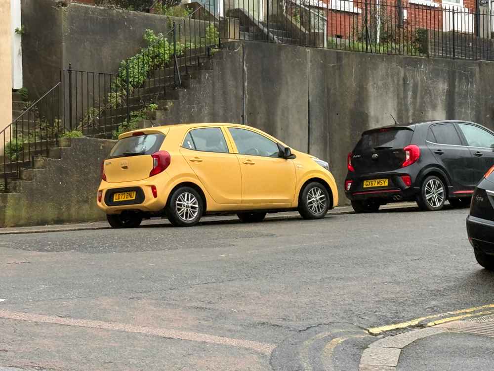 Photograph of LD73 BNU - a Yellow Kia Picanto parked in Hollingdean by a non-resident. The tenth of ten photographs supplied by the residents of Hollingdean.