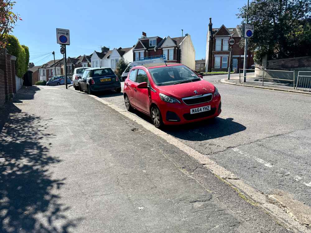 Photograph of MA64 YHZ - a Red Peugeot 108 parked in Hollingdean by a non-resident who uses the local area as part of their Brighton commute. The thirteenth of thirteen photographs supplied by the residents of Hollingdean.
