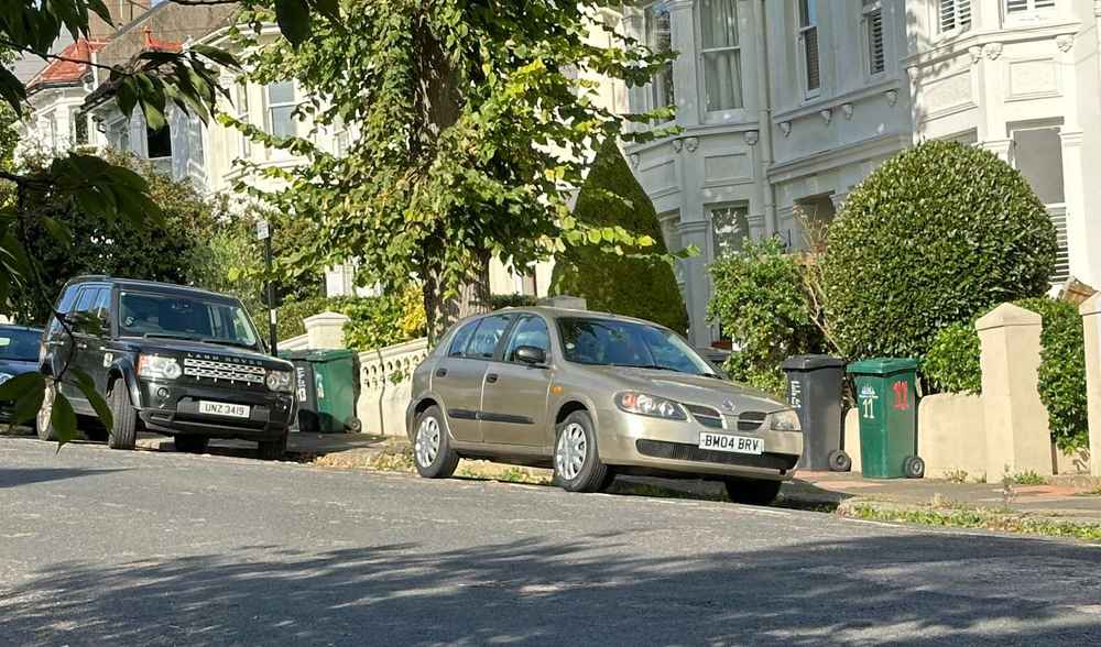 Photograph of BM04 BRV - a Gold Nissan Almera parked in Hollingdean by a non-resident. The third of three photographs supplied by the residents of Hollingdean.