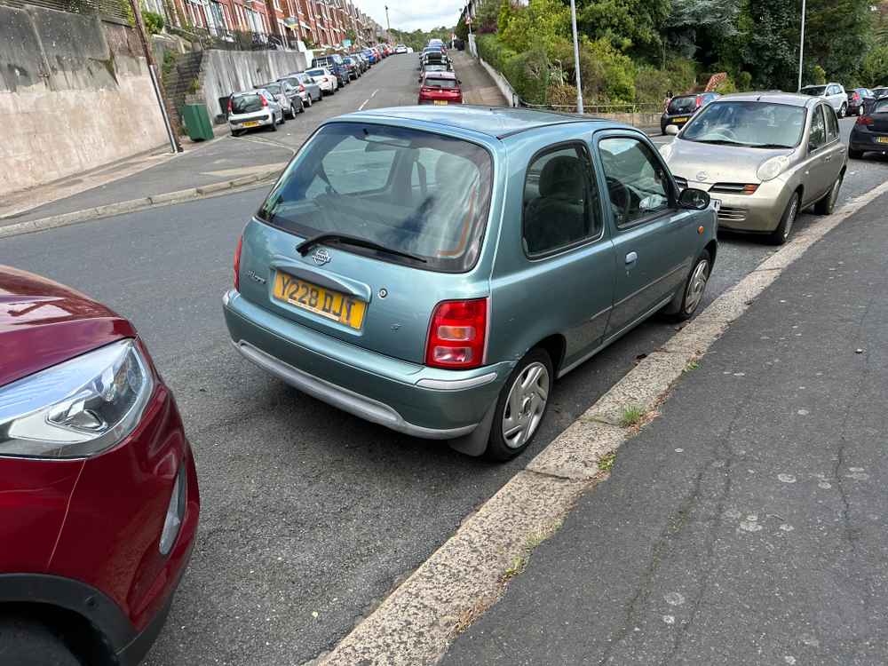 Photograph of Y228 DJT - a Green Nissan Micra parked in Hollingdean by a non-resident, and potentially abandoned. The third of four photographs supplied by the residents of Hollingdean.