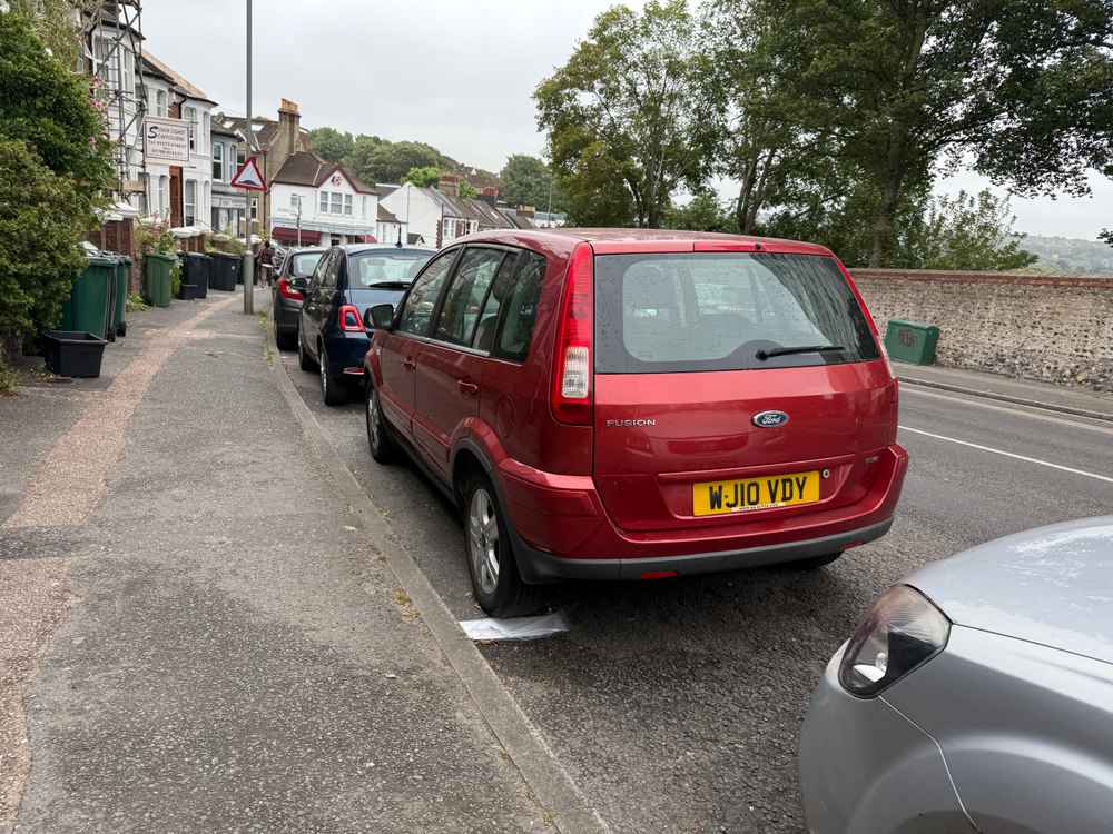 Photograph of WJ10 VDY - a Red Ford Fusion parked in Hollingdean by a non-resident. The fourth of four photographs supplied by the residents of Hollingdean.