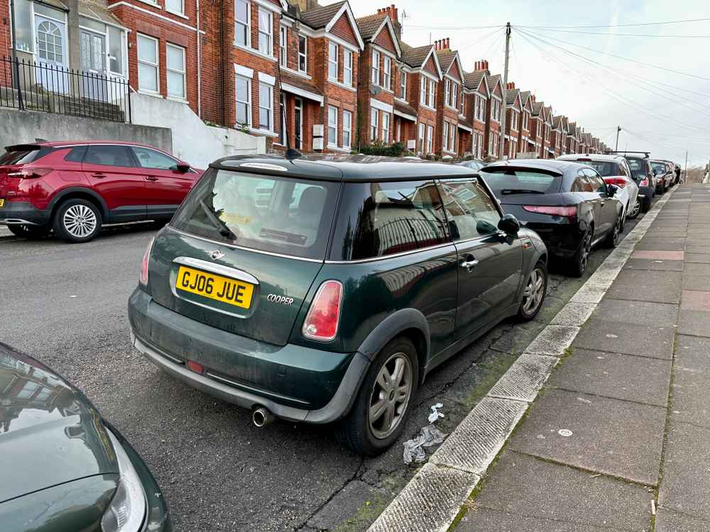 Photograph of GJ06 JUE - a Green Mini Cooper parked in Hollingdean by a non-resident. The sixth of fourteen photographs supplied by the residents of Hollingdean.