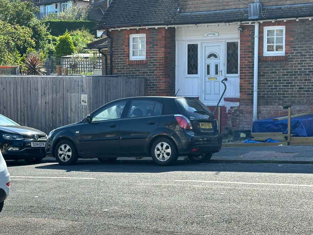 Photograph of WM59 VZG - a Black Kia Rio parked in Hollingdean by a non-resident. The ninth of nine photographs supplied by the residents of Hollingdean.