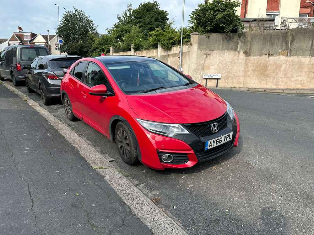 Photograph of AY66 VPL - a Red Honda Civic parked in Hollingdean by a non-resident. The second of seven photographs supplied by the residents of Hollingdean.