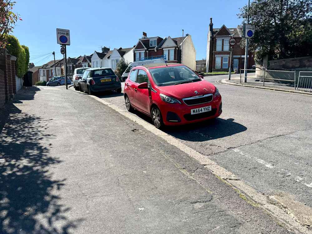 Photograph of MA64 YHZ - a Red Peugeot 108 parked in Hollingdean by a non-resident who uses the local area as part of their Brighton commute. The thirteenth of fourteen photographs supplied by the residents of Hollingdean.