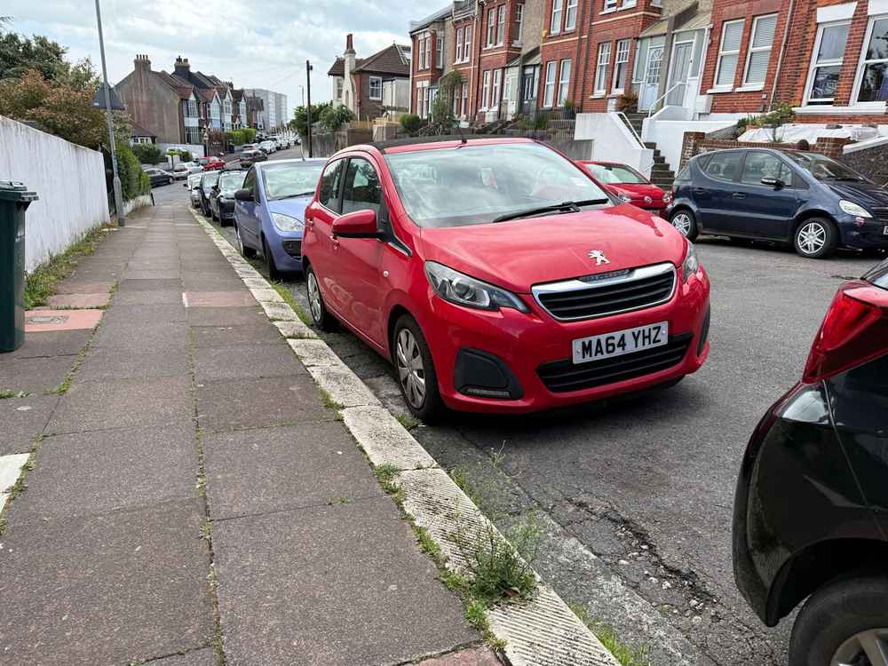 Photograph of MA64 YHZ - a Red Peugeot 108 parked in Hollingdean by a non-resident who uses the local area as part of their Brighton commute. The fourteenth of fourteen photographs supplied by the residents of Hollingdean.