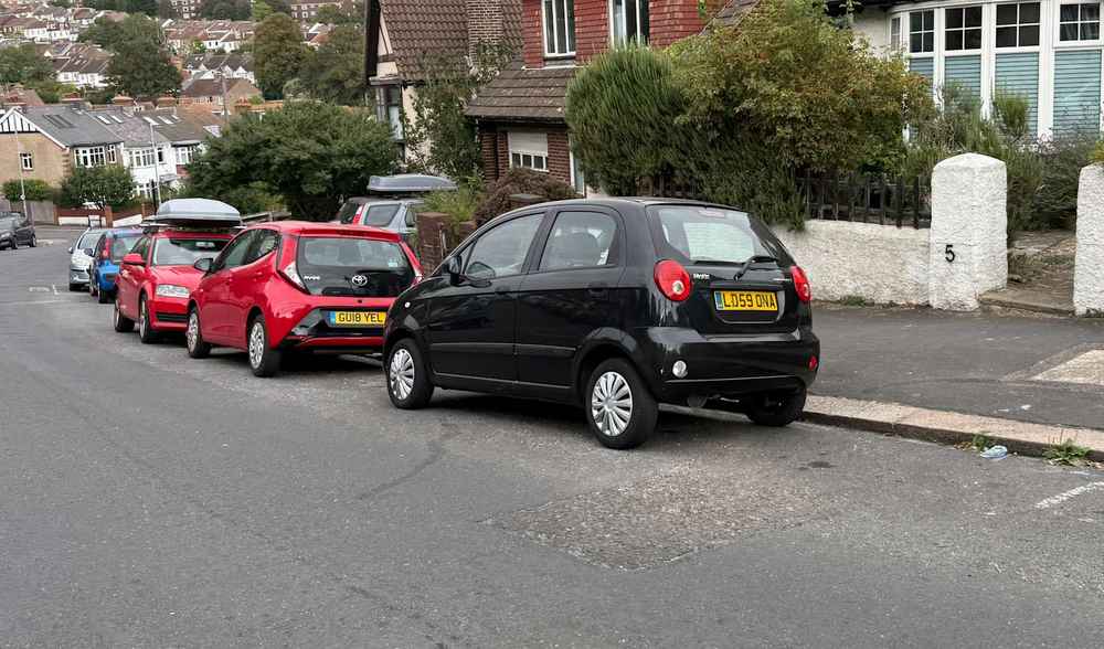 Photograph of LD59 ONA - a Black Daewoo Matiz parked in Hollingdean by a non-resident. The first of four photographs supplied by the residents of Hollingdean.