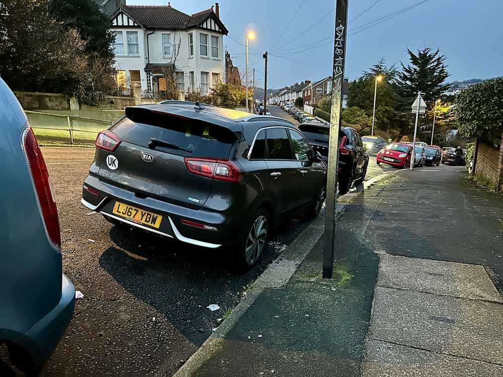 Photograph of LJ67 YDW - a Grey Kia Niro parked in Hollingdean by a non-resident. 