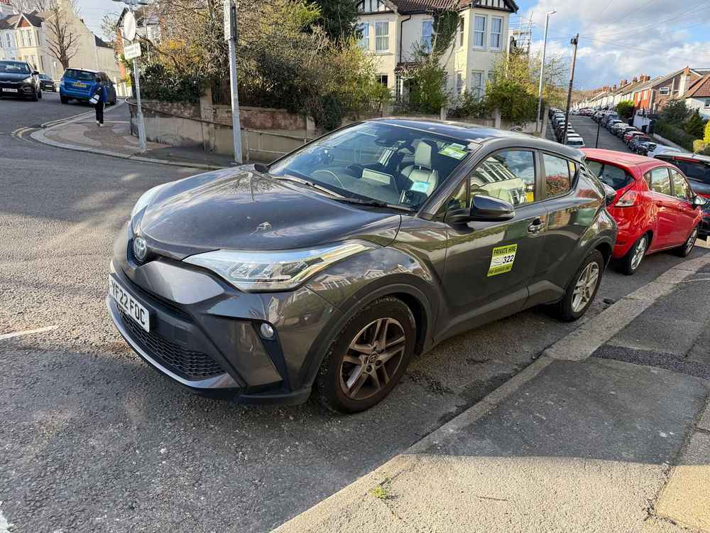 Photograph of YF22 FOC - a Grey Toyota C-HR taxi parked in Hollingdean by a non-resident. The eleventh of eleven photographs supplied by the residents of Hollingdean.