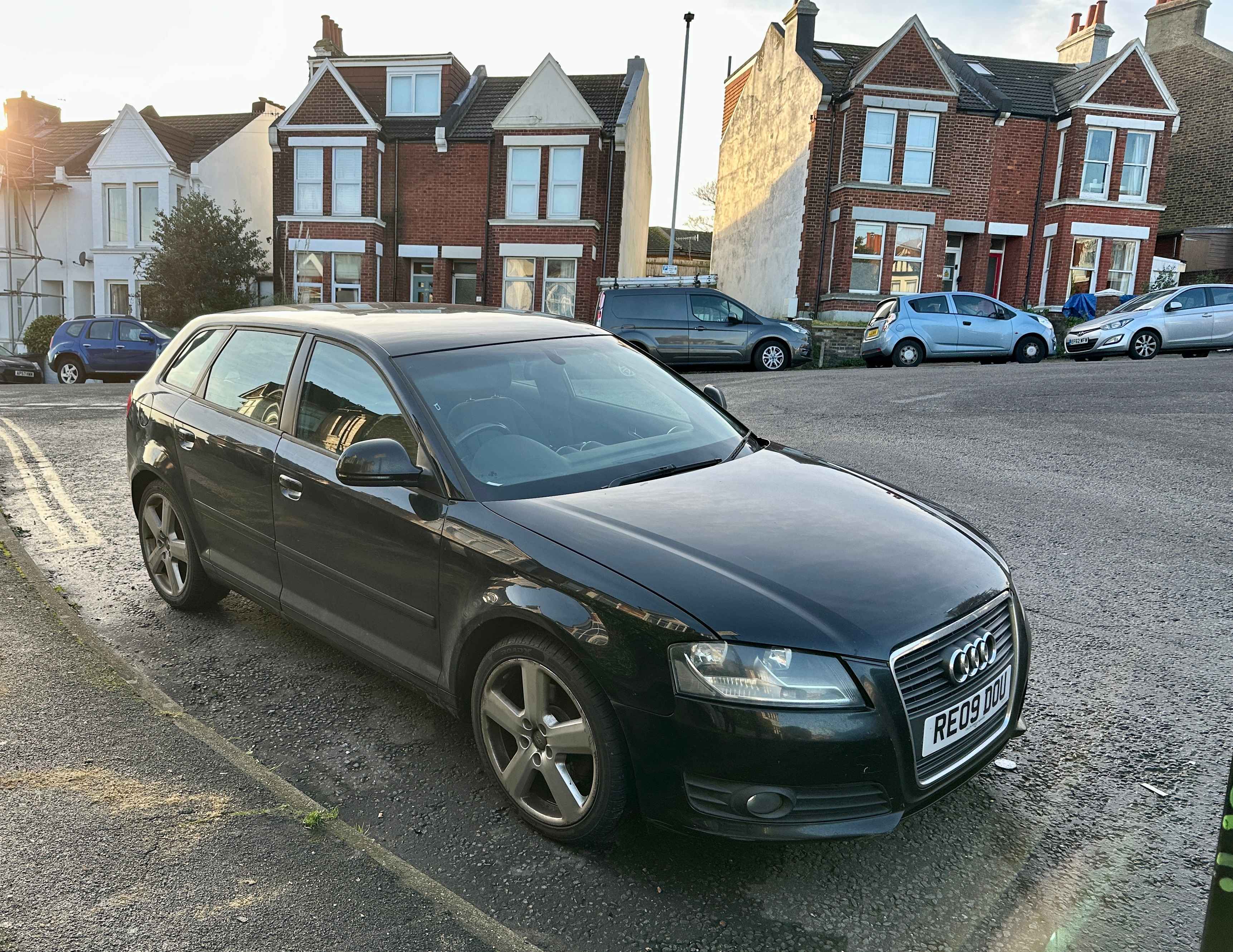 Photograph of RE09 DOU - a Black Audi A3 parked in Hollingdean by a non-resident who uses the local area as part of their Brighton commute. The sixth of six photographs supplied by the residents of Hollingdean.