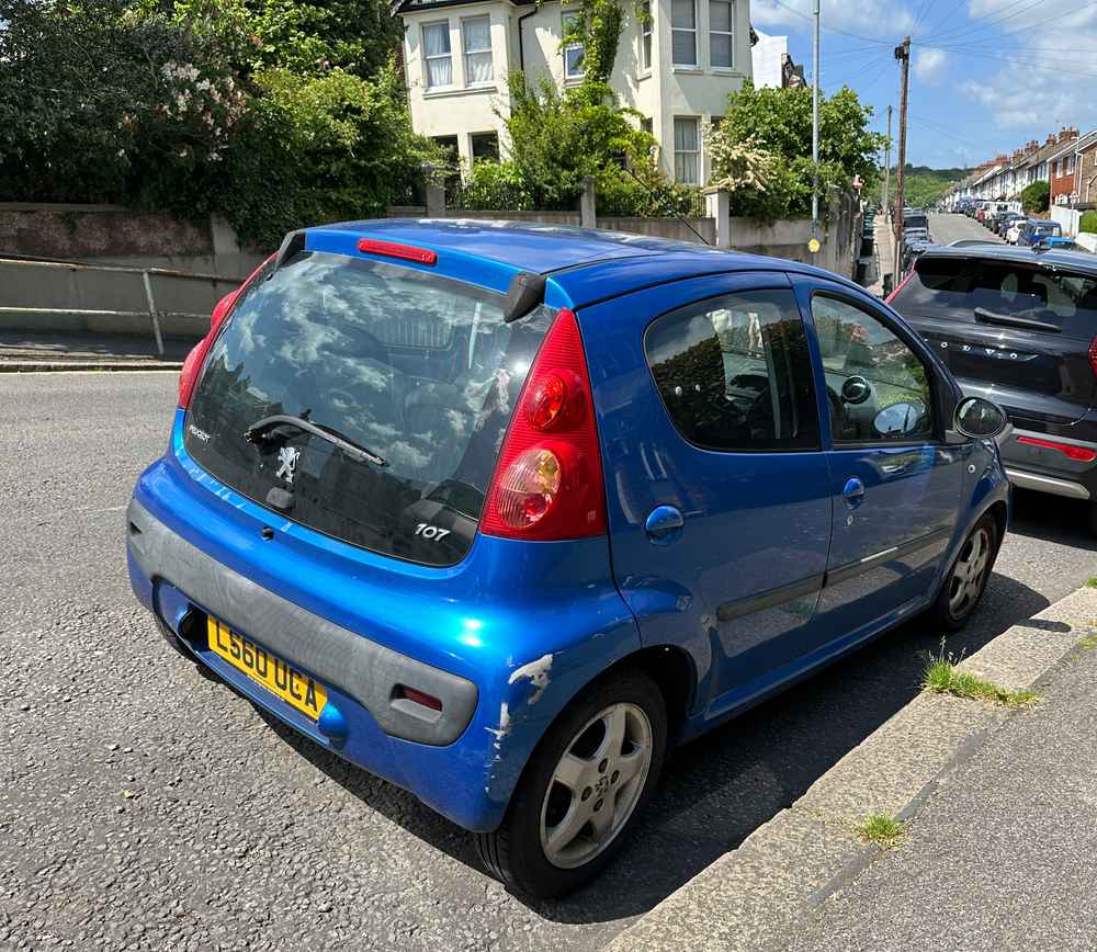 Photograph of LS60 UCA - a Blue Peugeot 107 parked in Hollingdean by a non-resident. The twelfth of thirteen photographs supplied by the residents of Hollingdean.
