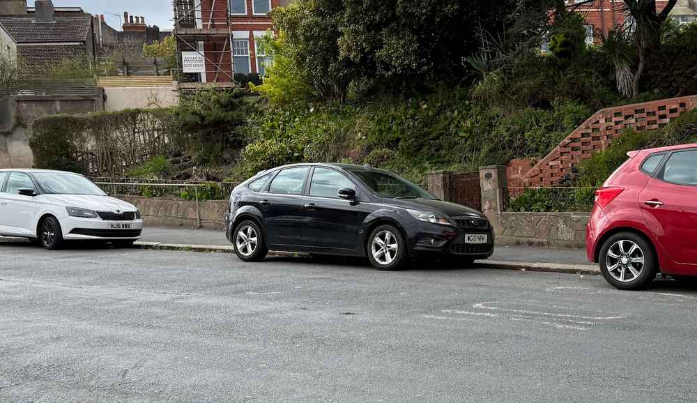 Photograph of WG10 NPK - a Black Ford Focus parked in Hollingdean by a non-resident. The sixth of seventeen photographs supplied by the residents of Hollingdean.