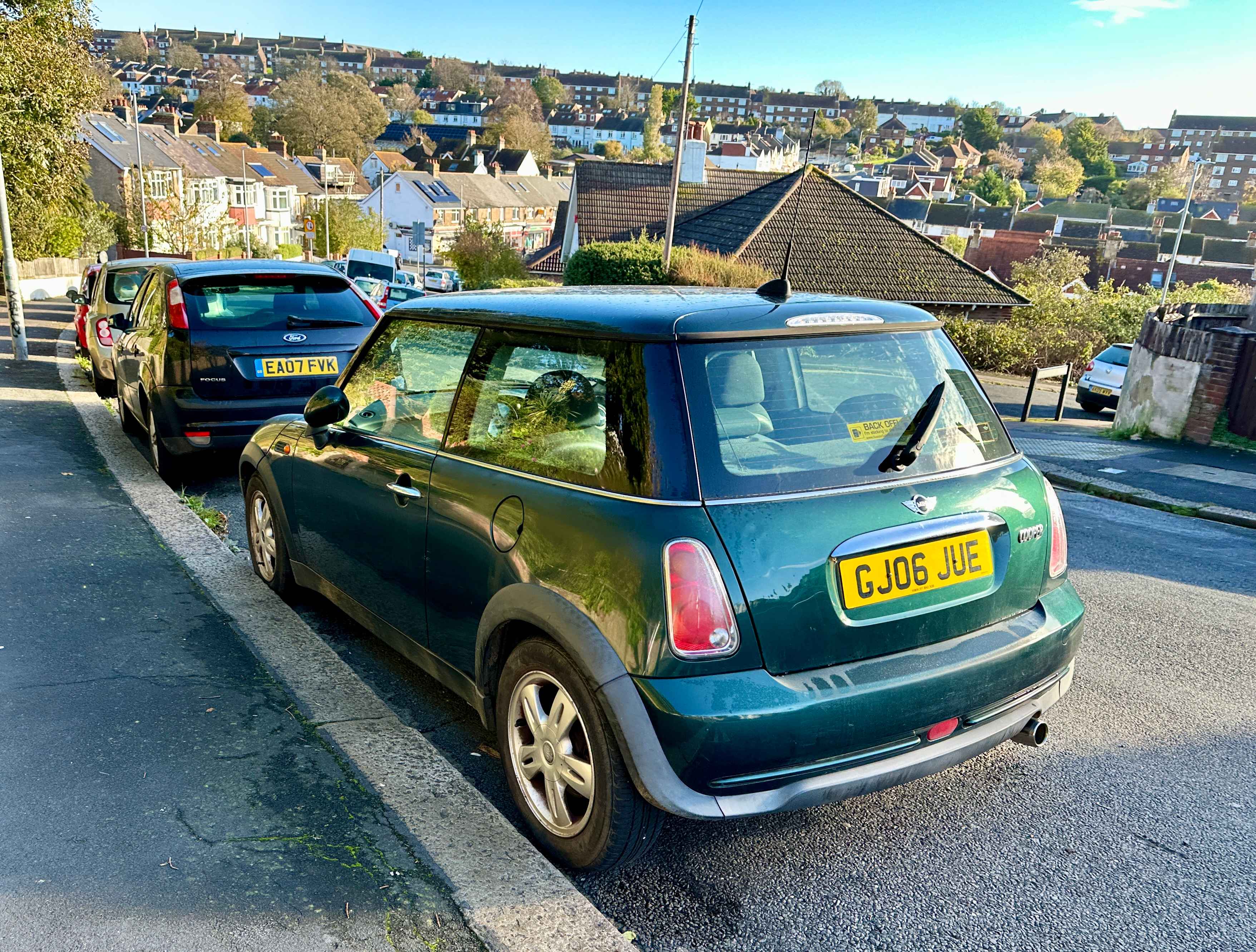 Photograph of GL06 JUE - a Green Mini Cooper parked in Hollingdean by a non-resident. The first of seven photographs supplied by the residents of Hollingdean.