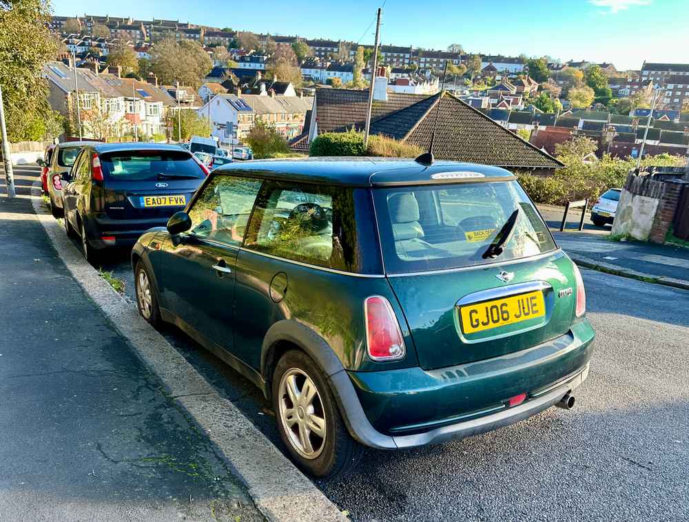 Photograph of GJ06 JUE - a Green Mini Cooper parked in Hollingdean by a non-resident. The first of fourteen photographs supplied by the residents of Hollingdean.