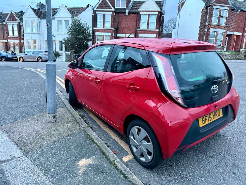 Photograph of BF15 HRO - a Red Toyota Aygo parked in Hollingdean by a non-resident who uses the local area as part of their Brighton commute. The fourth of four photographs supplied by the residents of Hollingdean.