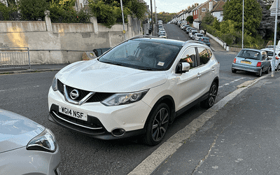 WG14 NSF, a White Nissan Qasqai parked in Hollingdean