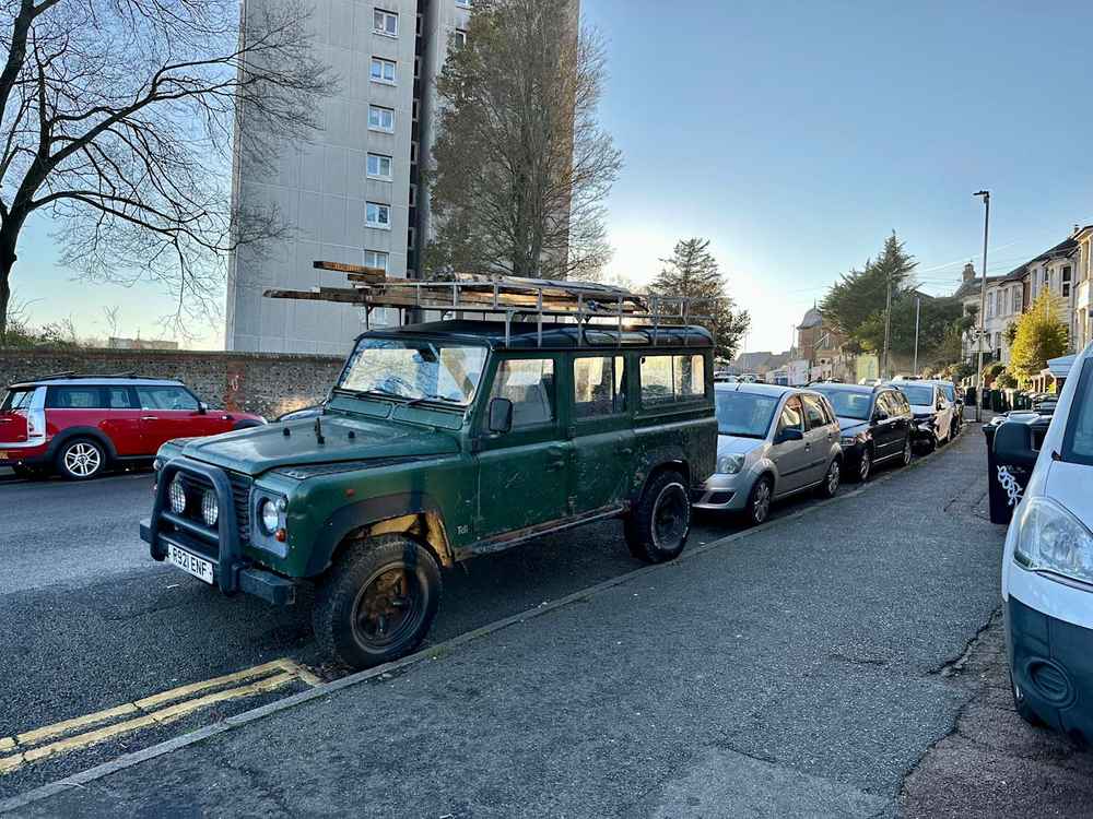 Photograph of R921 ENF - a Green Land Rover Defender parked in Hollingdean by a non-resident. The third of twelve photographs supplied by the residents of Hollingdean.