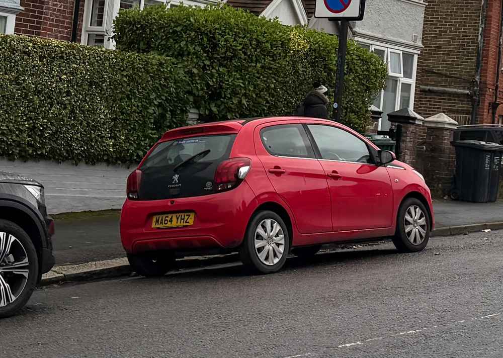 Photograph of MA64 YHZ - a Red Peugeot 108 parked in Hollingdean by a non-resident who uses the local area as part of their Brighton commute. The tenth of ten photographs supplied by the residents of Hollingdean.