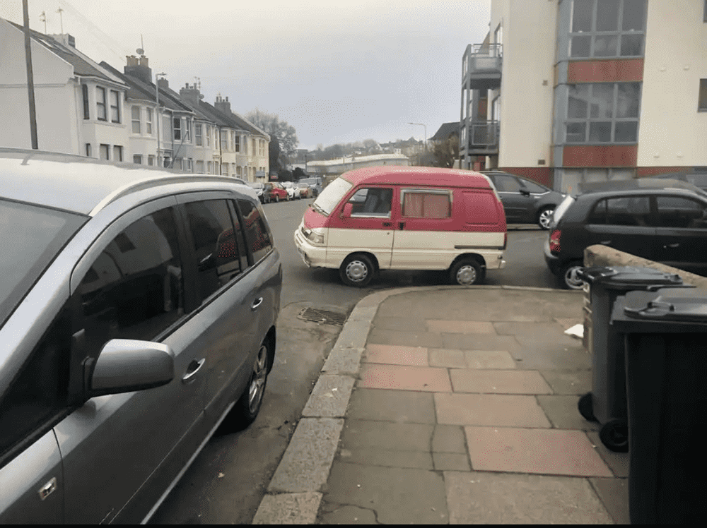 Photograph of W844 RHR - a Pink Daihatsu Hijet camper van parked in Hollingdean by a non-resident, and potentially abandoned. The third of three photographs supplied by the residents of Hollingdean.