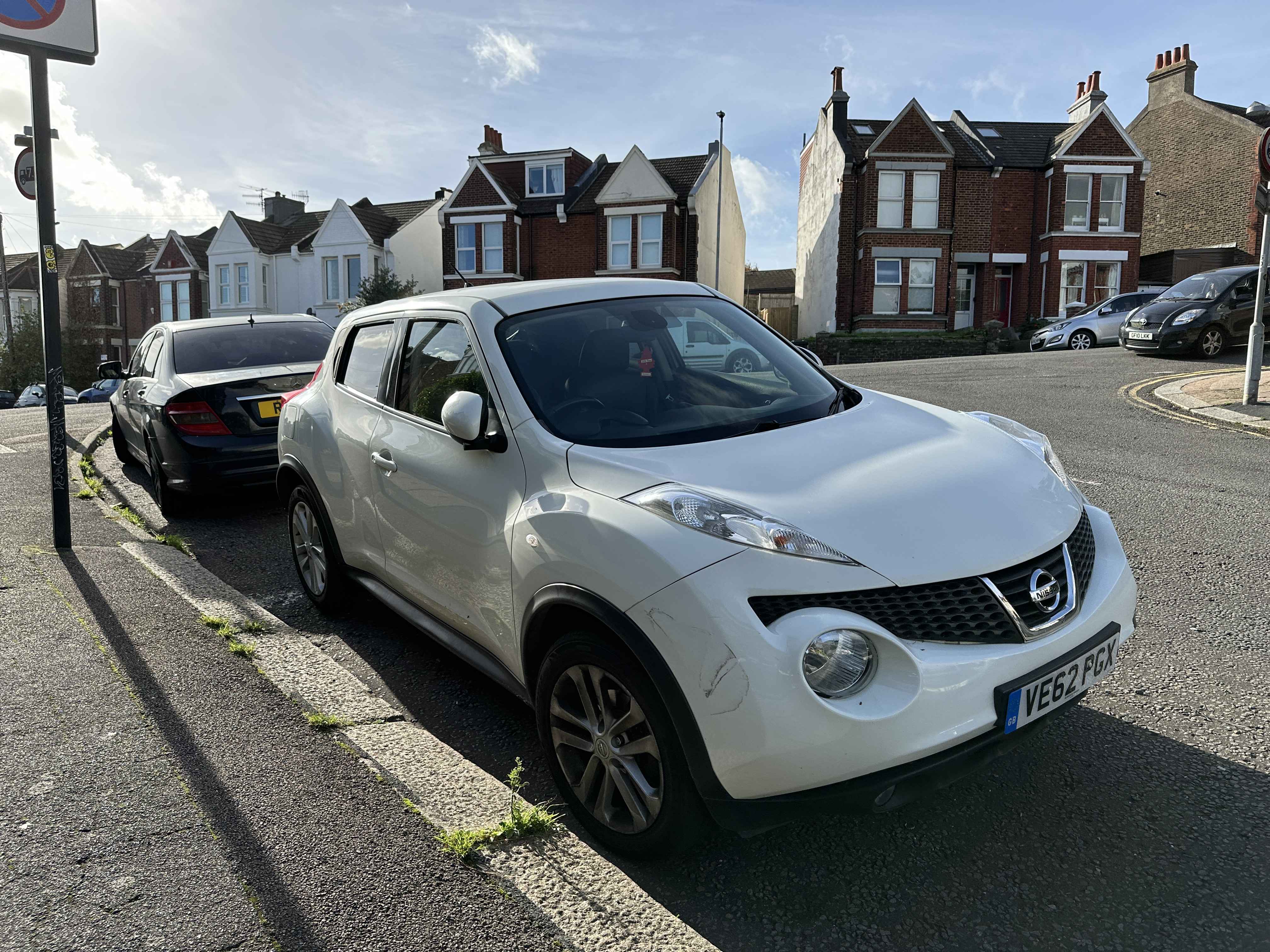 Photograph of VE62 PGX - a White Nissan Juke parked in Hollingdean by a non-resident who uses the local area as part of their Brighton commute. 