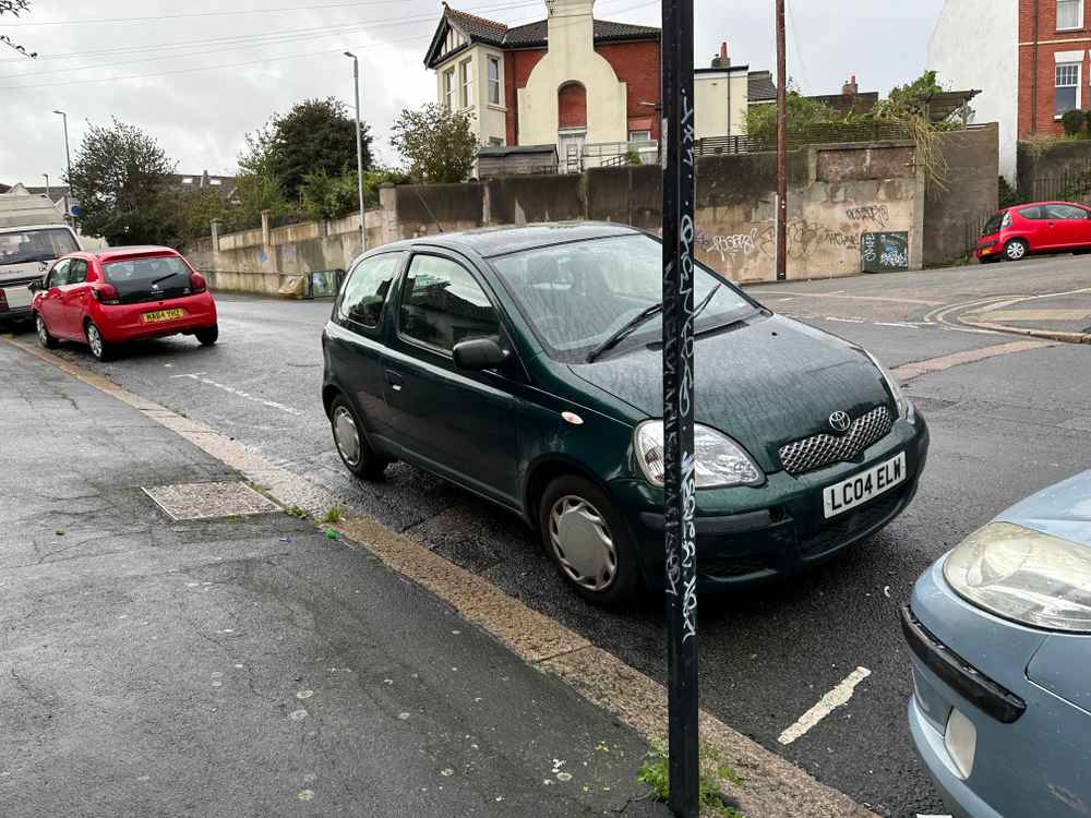 Photograph of LC04 ELW - a Green Toyota Yaris parked in Hollingdean by a non-resident. The fifth of twelve photographs supplied by the residents of Hollingdean.
