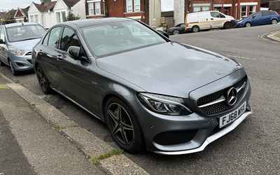 FJ68 WHX, a Grey Mercedes C Class parked in Hollingdean