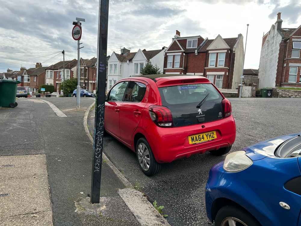 Photograph of MA64 YHZ - a Red Peugeot 108 parked in Hollingdean by a non-resident who uses the local area as part of their Brighton commute. The ninth of nine photographs supplied by the residents of Hollingdean.