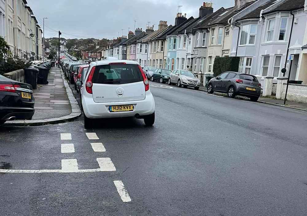 Photograph of HJ12 KVX - a White Vauxhall Agila parked in Hollingdean by a non-resident. The second of two photographs supplied by the residents of Hollingdean.